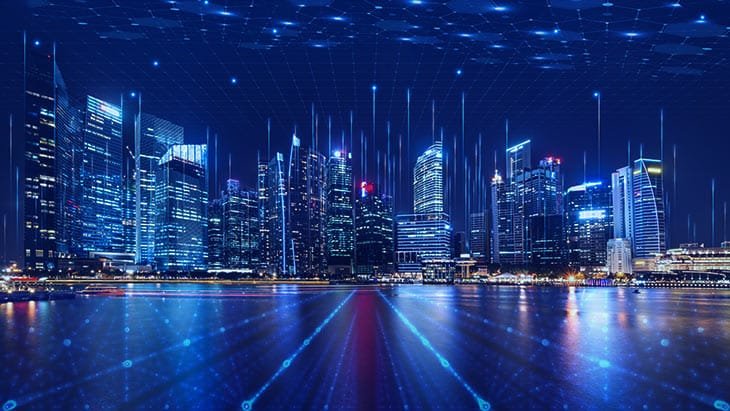 Futuristic smart city skyline at night with a connected network overlay